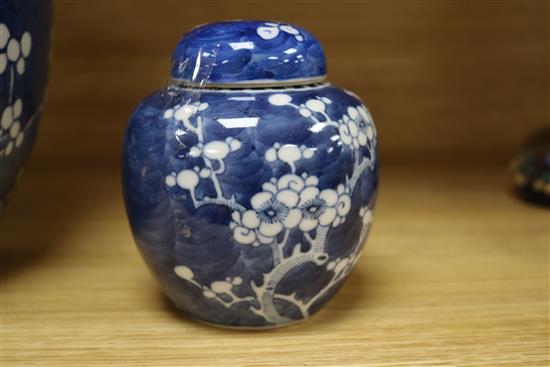 A large Chinese prunus jar and cover and another small jar